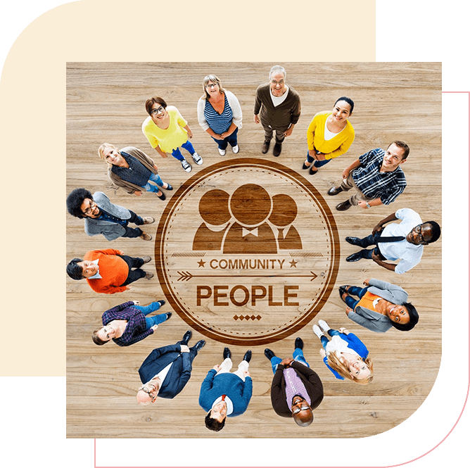 A group of people sitting in a circle on top of a wooden floor.