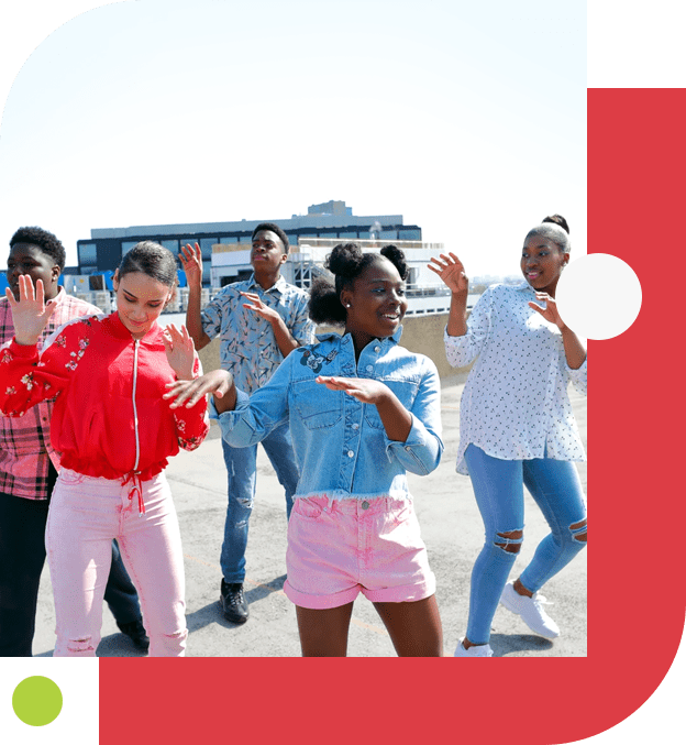 A group of people dancing in the street.